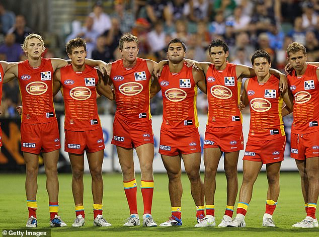 When the Suns played their first match against Carlton in 2011, their guernsey was much more yellow with a bolder team logo and a list of the first team names.