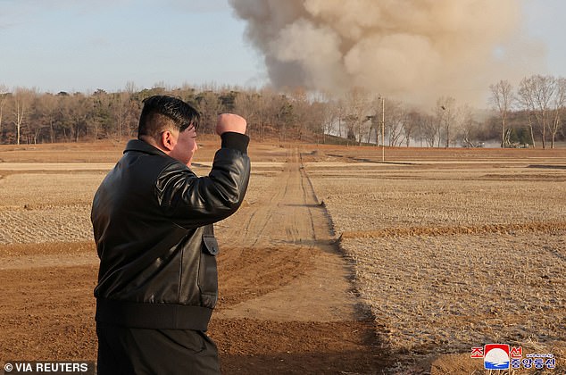 North Korean leader Kim Jong Un gestures as he leads a fire division training in North Korea