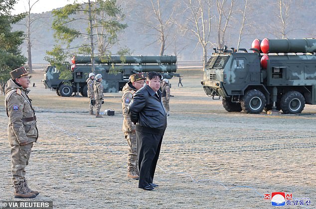 Kim was seen wearing a leather jacket as he watched the military exercise