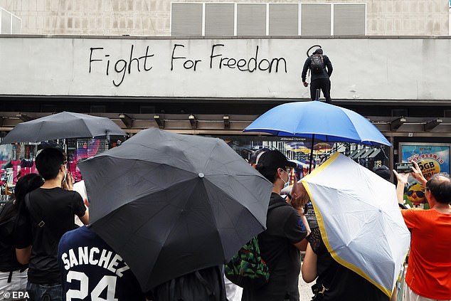 A protester writes 'Fight for freedom' on a wall during a rally in Hong Kong, China, August 31, 2019