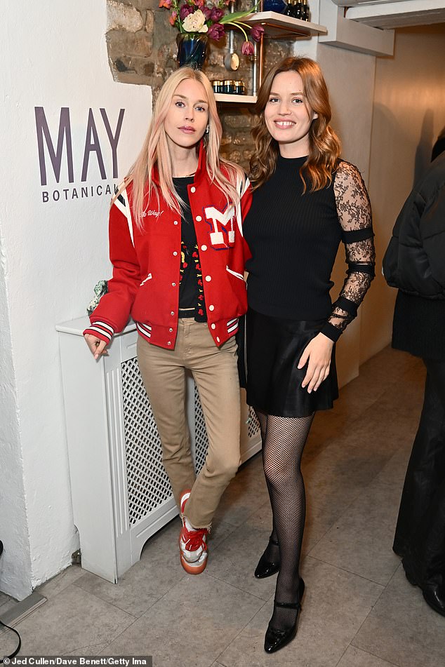 She also wore a black knit sweater with sheer lace sleeves and added to her height with patent leather Mary Jane heels (pictured wearing Mary Charteris)