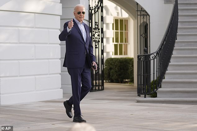 President Joe Biden walks out wearing a new pair of shoes to board Marine One on the South Lawn of the White House