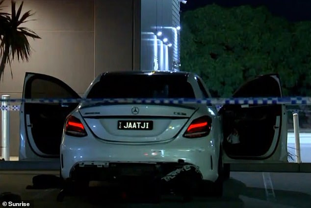 Police surrounded an abandoned Mercedes that appeared to be damaged