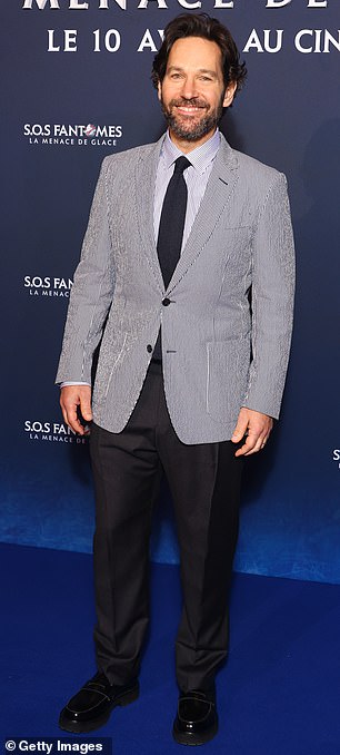 Rudd, 54, wore a blue seersucker jacket over a matching shirt with a black knit tie