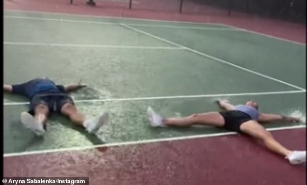 The couple made rain angels during a rainstorm on the track