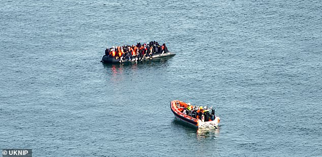 A French coast guard ship approached the boat, which continued its journey