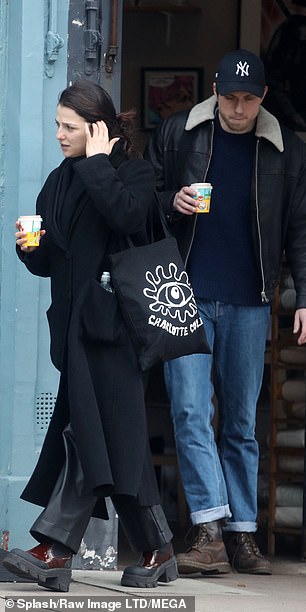 She carried her essentials in a funky black and white tote bag