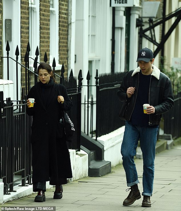 Meanwhile, her theater star boyfriend kept it casual in a black leather jacket with white fur collar and blue jeans