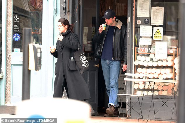 He accessorized the look with a black New York baseball hat and a pair of brown lace-up sneakers, as the two kept their looks low-key