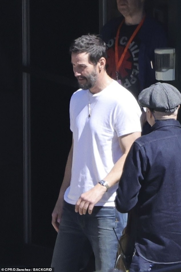 Keanu at one point ditched his jacket to show off his fit torso in a white T-shirt