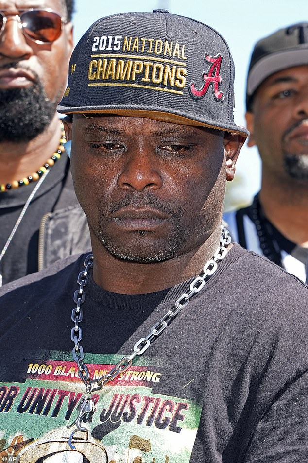 Eddie Terrell Parker listens as his legal team visits a federal judge during a news conference Monday