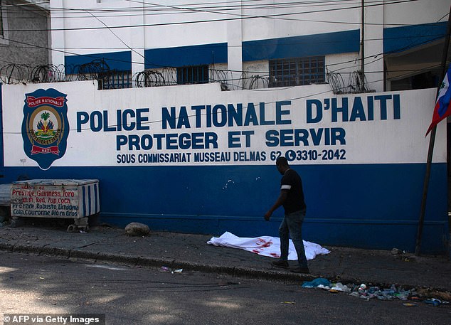 People in communities under fire called radio stations and begged for help from Haiti's national police, who are outnumbered by the gangs.  A body lies outside the police building in Port-au-Prince