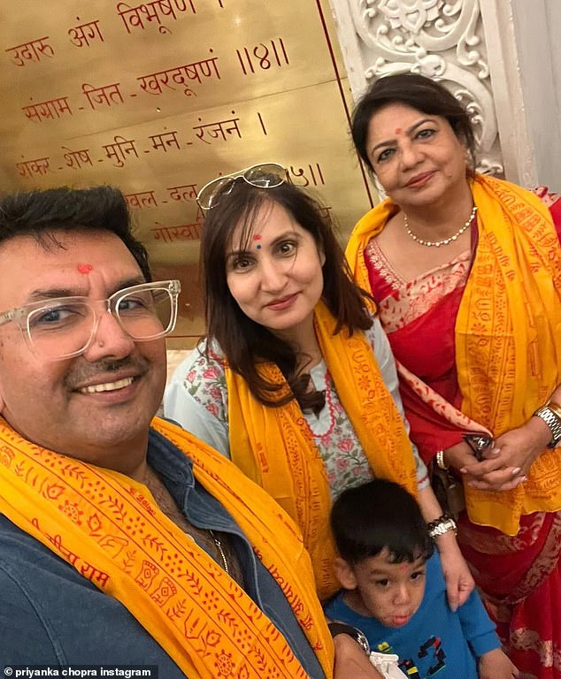 Priyanka's mother, Dr. Madhu Chopra, accompanied them to the temple in a beautiful red saree