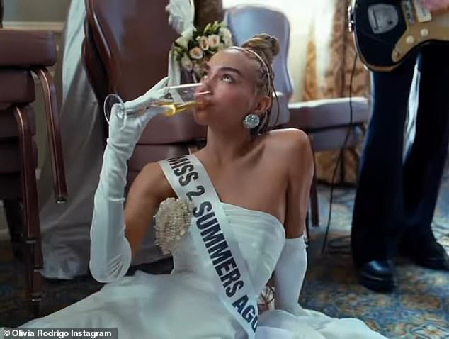 At this point in the preview clip, the montage starts to speed up and there is another young lady wearing a 'Miss 2 Summers Ago' sash, seen on the floor drinking champagne.