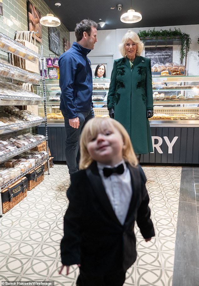 The youngster posed for the cameras today as Camilla visited Knotts bakery in Belfast today