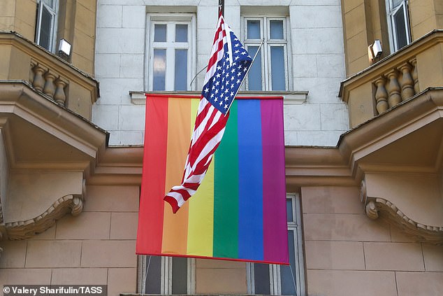 JUNE 25, 2020: The US national flag and an LGBT pride flag on the facade of the US Embassy in Moscow