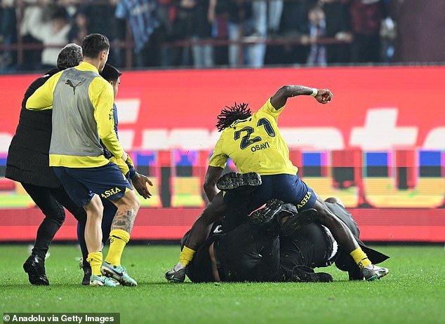 The violence at Trabzonspor started when a lone supporter stormed onto the pitch before former QPR star Bright Osayi-Samuel intervened.