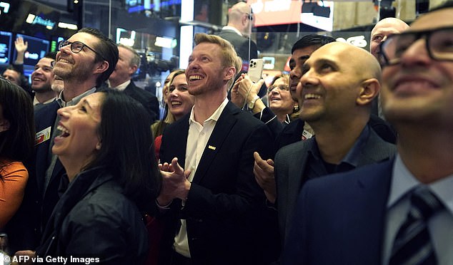 CEO and co-founder Steve Huffman (photo, center) visited Wall Street on Thursday morning