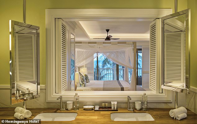 The bathroom and master bedroom in one of the hotel apartments