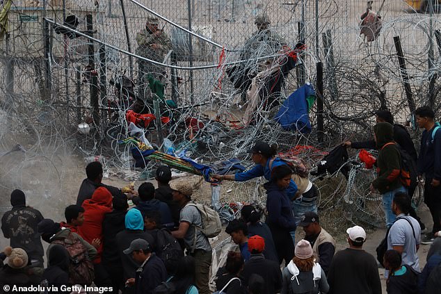 Migrants from Central and South America wait in Mexico for admission to the US