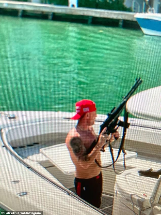 The week before, this image surfaced of Carroll sitting on his yacht astride what appeared to be an assault rifle