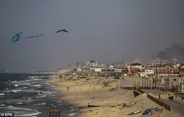 Smoke rises in the background after an Israeli airstrike in Gaza City, northern Gaza Strip, March 21, 2024. More than 31,500 Palestinians and more than 1,300 Israelis were killed, according to the Palestinian Ministry of Health and the Israeli army.