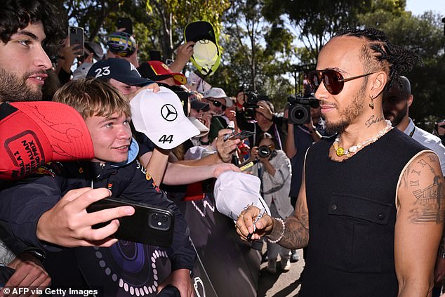 Mercedes' British driver Lewis Hamilton looked every bit a rock star as he met fans in Melbourne this week