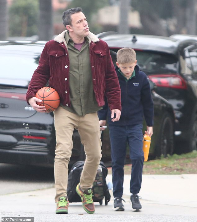 The actor and director showed off his fuzz-free face while on dad duty with his son Samuel, 12