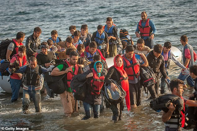 After the grueling journey, he was able to call his father, whose number he had memorized, to tell him he was okay (stock photo of migrants arriving in Greece)