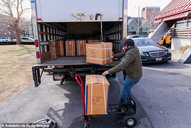 Taunton officials say the hotel should be available to veterans in need and the state's homeless population.  Pictured: Homeless people move into a recreation center in Roxbury, Boston, Massachusetts