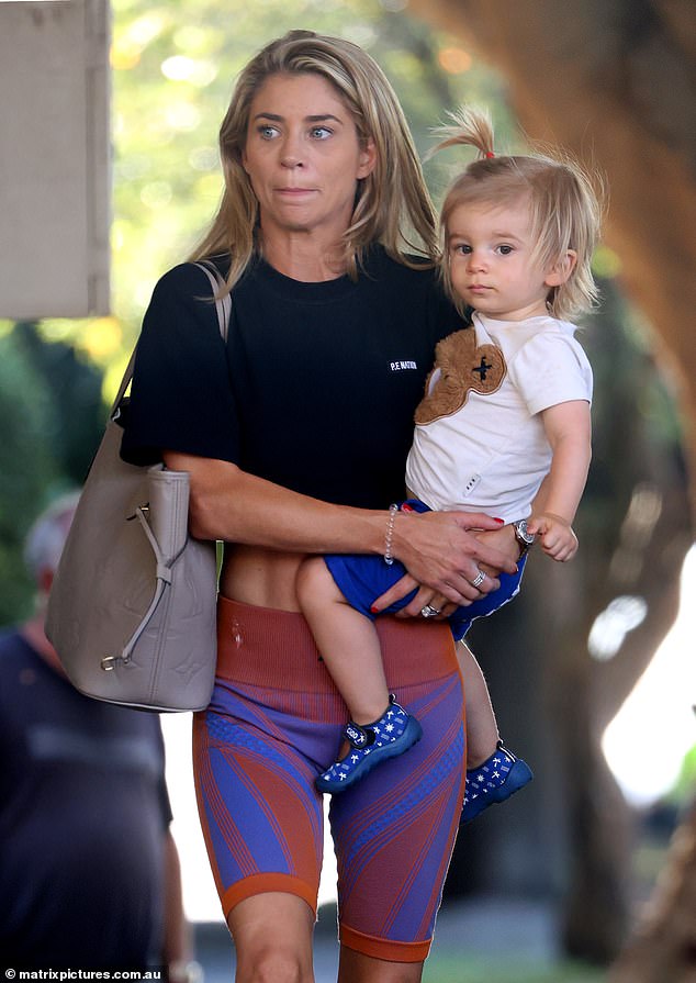 Otto looked as cute as a button in a white T-shirt and blue shorts as he joined his mother for an outing