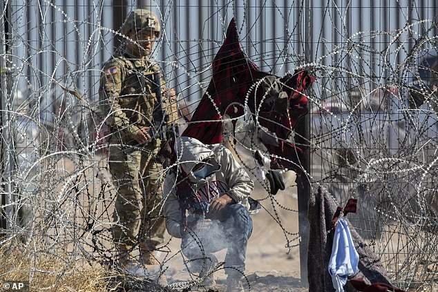 Migrants were escorted outside the barrier again after the incident on Thursday