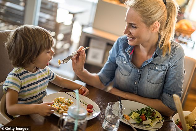 The waiter gave her free hot chocolate after she noticed she was having a hard time dealing with her son's reactions.  (Image: a stock photo of a child with his mother)