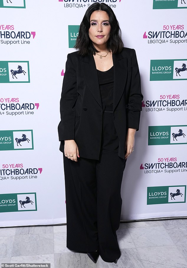 Singer Jessie Ware also wore black, opting for a wide-leg suit and shiny, pointy black high heels
