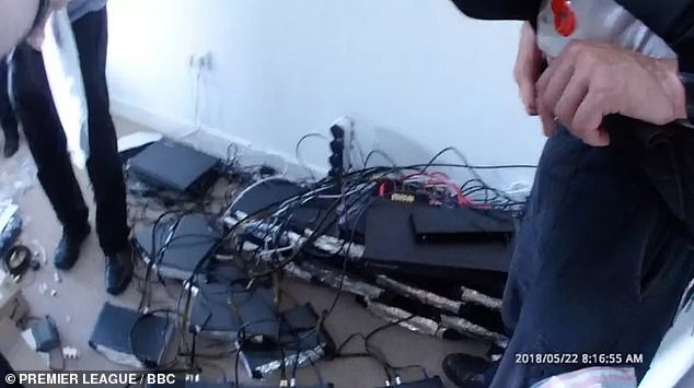 Bodycam footage also shows around 30 linked set-top boxes used in the illegal operation stacked up in the building