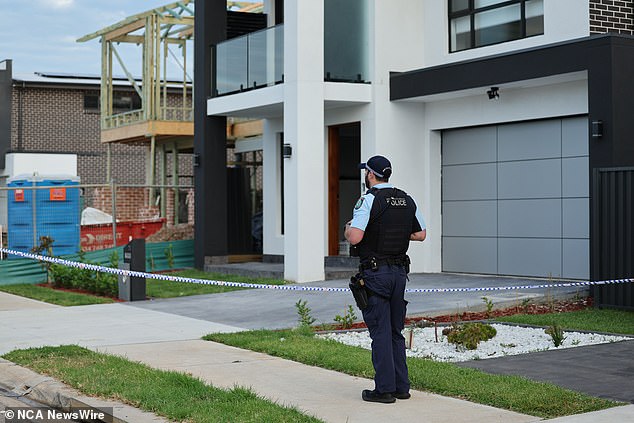 Police have cordoned off a crime scene (pictured) and are investigating the alleged murder