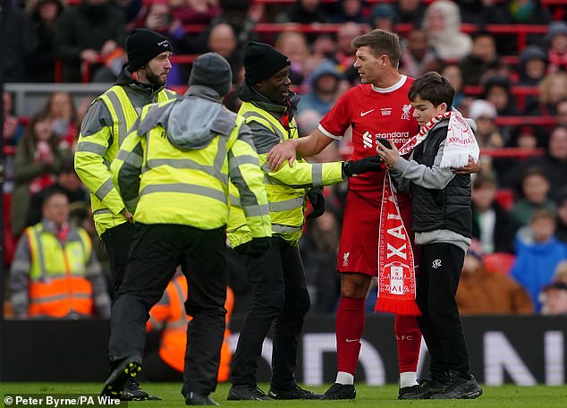 After avoiding the stewards, the fan managed to take a selfie with Reds legend Steven Gerrard