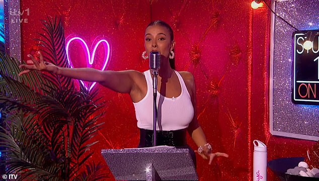 Maya completed her look with a sleek ponytail and a red lip as she danced with the energetic crowd - making sure there was a signature Love Island bottle by her side