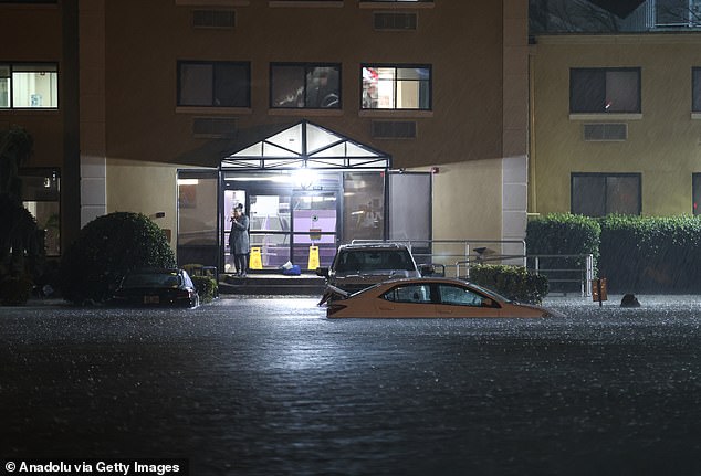 A heavy rainstorm floods New York City, dumping buckets on the streets and flooding subway stations with up to four inches of water