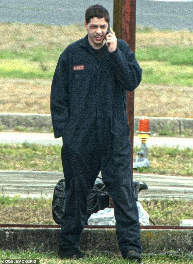 Pete Davidson, 30, was dressed in oversized black overalls.  His dark hair was brushed forward and he had a scruffy beard