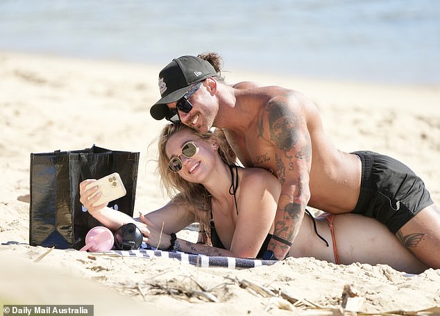 The controversial couple were also spotted taking a series of selfies as Jack lay on top of Tori on the beach