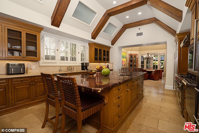 The mansion has a gourmet kitchen, complete with high-end appliances, and a walk-in pantry