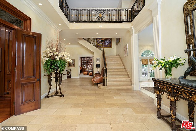 This immaculate 7-bedroom, 9-bathroom family home features high ceilings, a grand entrance with a dramatic spiral staircase and imported Italian limestone floors.