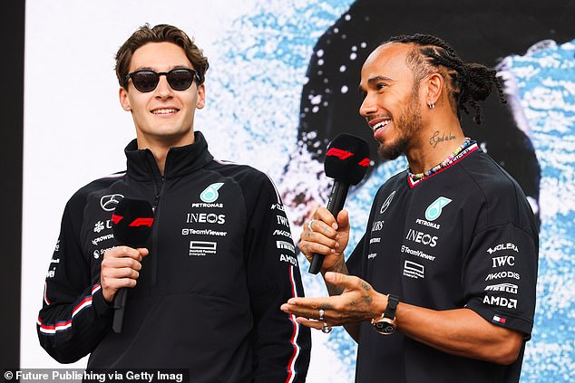Russell (pictured left with teammate Lewis Hamilton in Melbourne on Saturday) has made no comment on the 'reprehensible' video