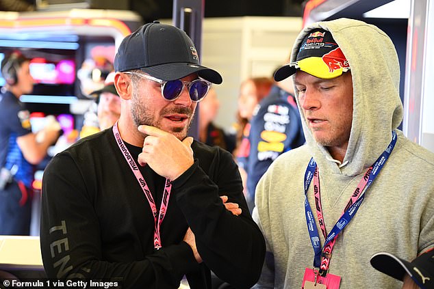 Efron, 36, was joined by a star-studded crowd on the grid ahead of the race at Albert Park, in the snap chatting with Australian actor Sam Worthington