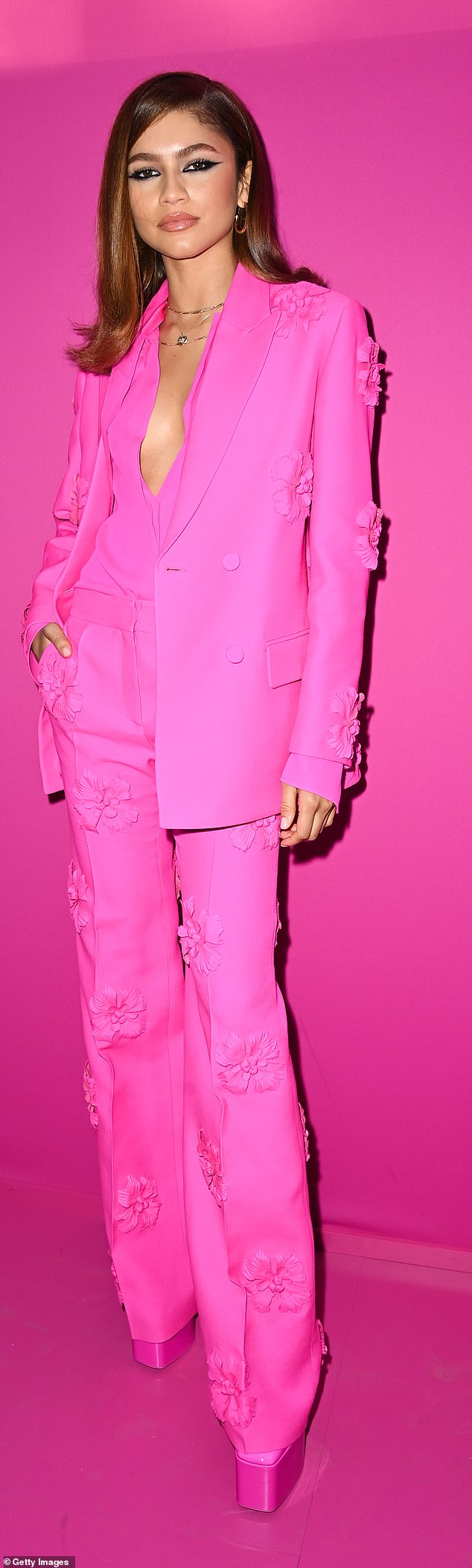 Zendaya (pictured) is pictured in hot pink at the 2022 Paris Fashion Week in Paris, France