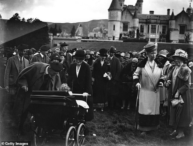 The Royal Garden Party at Balmoral.  From far left to right are: the Duke of York, King George V, Queen Mary and the Duchess of York.  Princess Elizabeth is sitting in the stroller