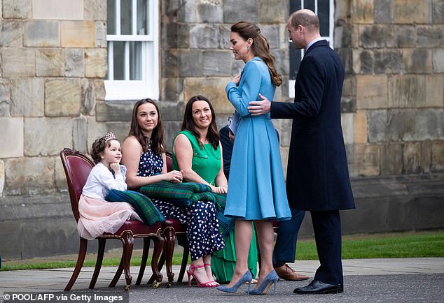 Mila speaks to Prince William and Catherine as she and her family attend a Beating Retreat of The Massed Pipes and Drums of the Combined Cadet Force in Scotland as special guests