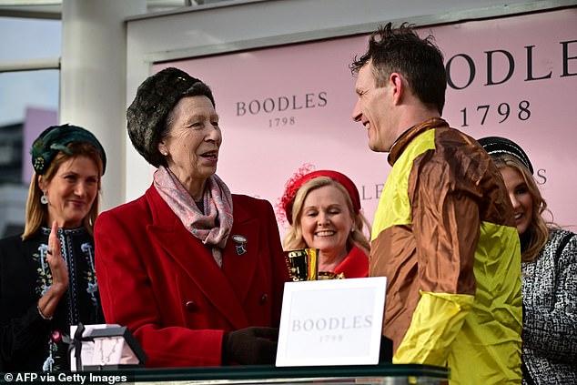 Pictured: Busy Anne was seen presenting winning jockey Paul Townend with a trophy at Cheltenham last week