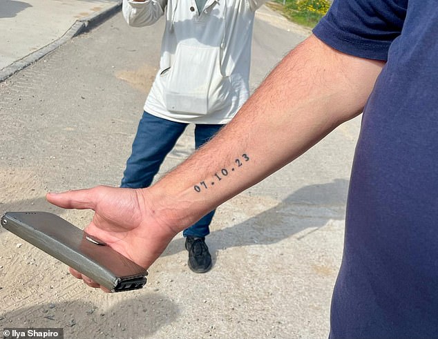 Shachar could be mistaken for a suburban American father, except for the date 07.10.23 tattooed on the inside of his forearm.